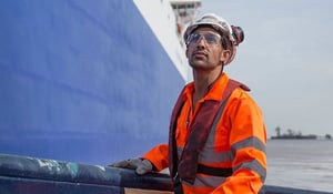 Shell employee in orange safety gear working on-site-600x350px